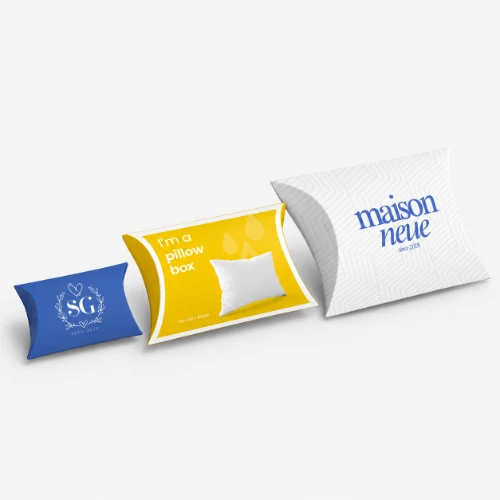 Three branded pillow boxes in blue, yellow, and white.