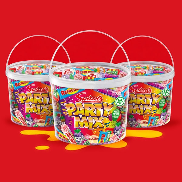 Three tubs of Swizzels Party Mix lollipops on a red background with yellow splashes.