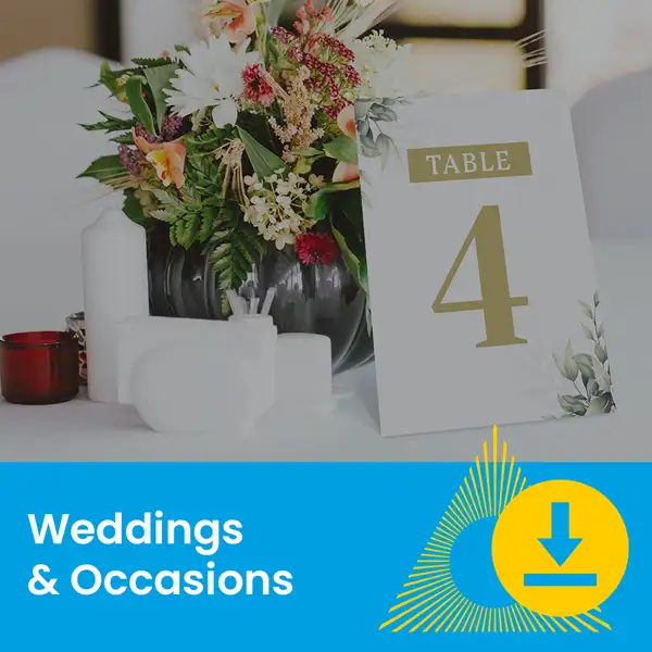 Floral centerpiece and table number 4 card on a decorated event table.