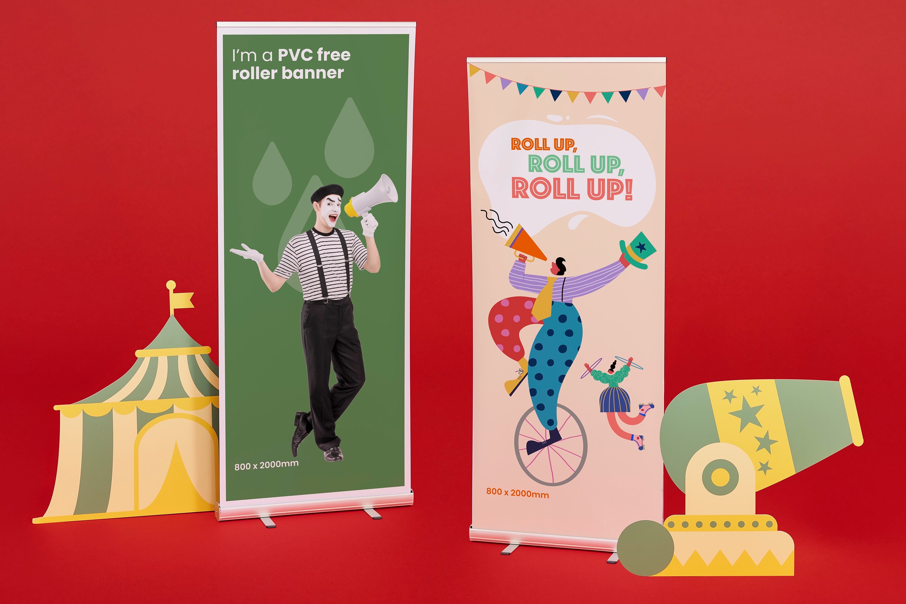 Two circus-themed roller banners with cutout props on a red background.