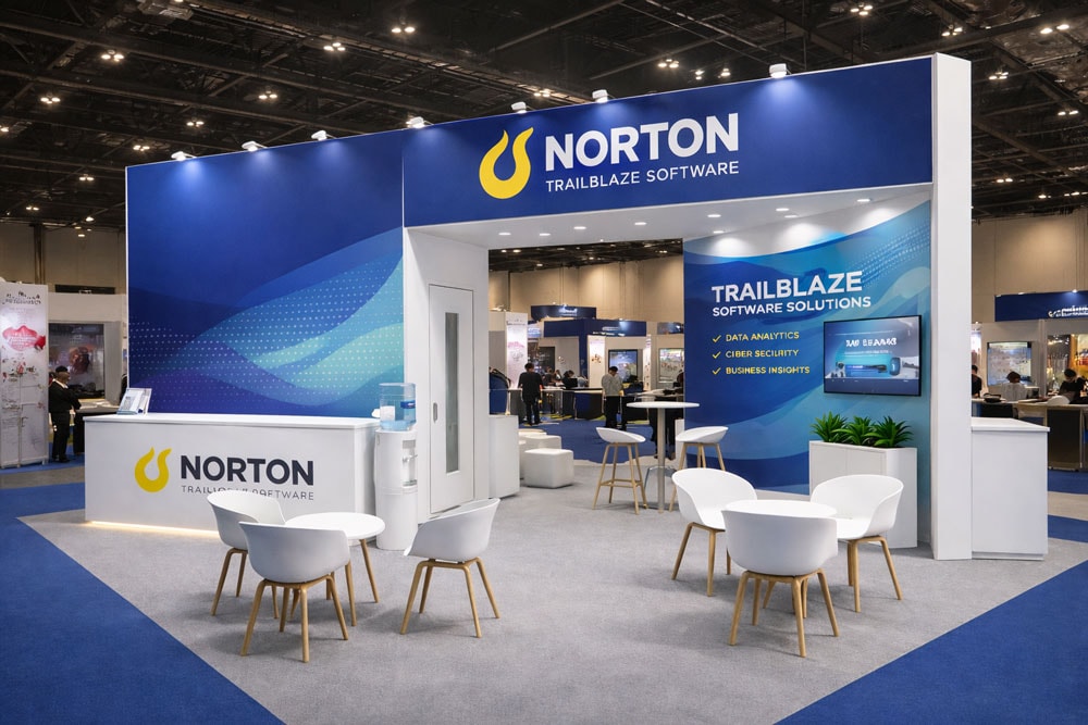 Software exhibition booth with chairs, table, and branded displays.