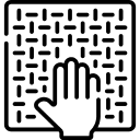 A hand touches a woven or textured square surface.