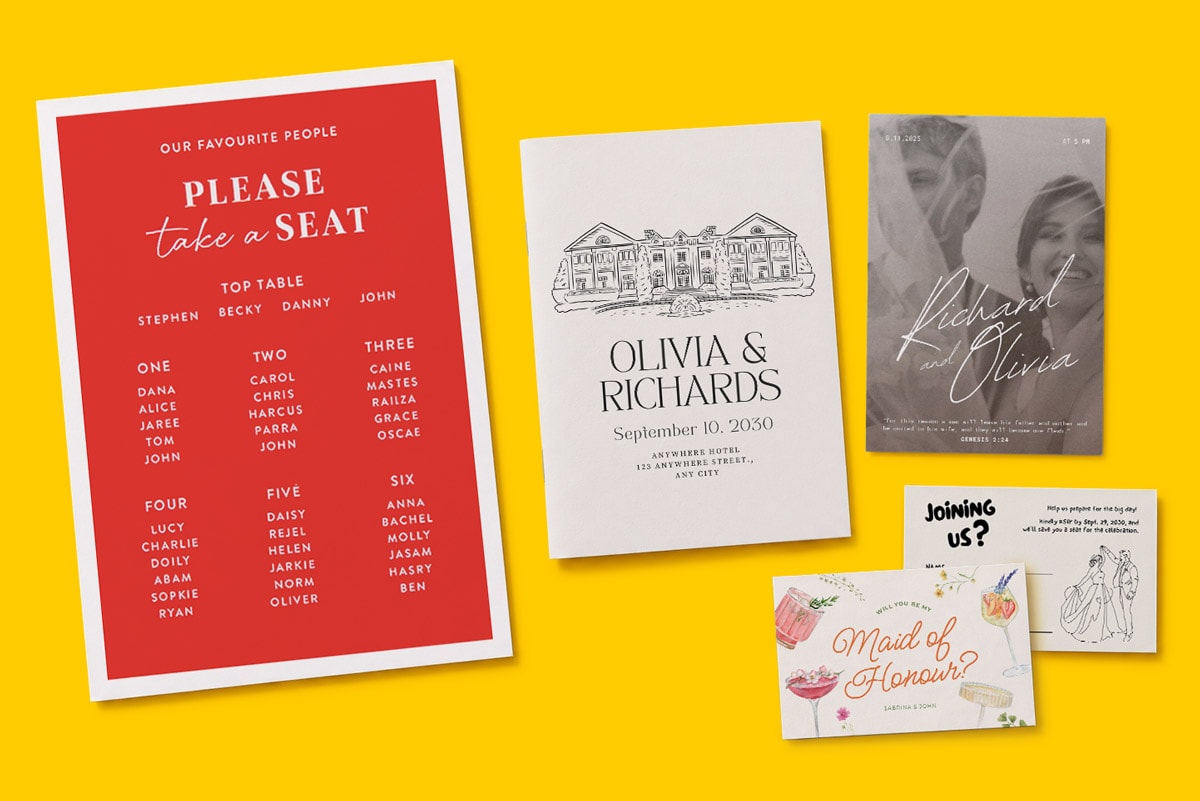 Assorted wedding stationery, including a seating chart, invitations, and RSVP cards on a yellow background.