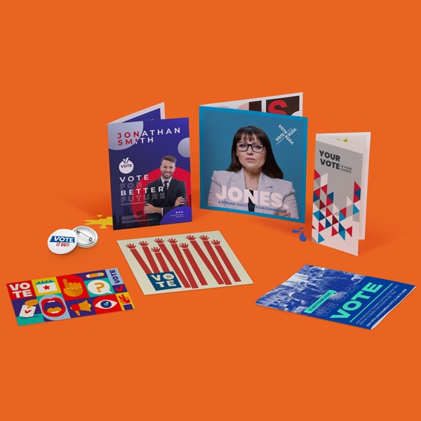 A set of colourful election campaign materials: flyers, buttons, stickers, and brochures.