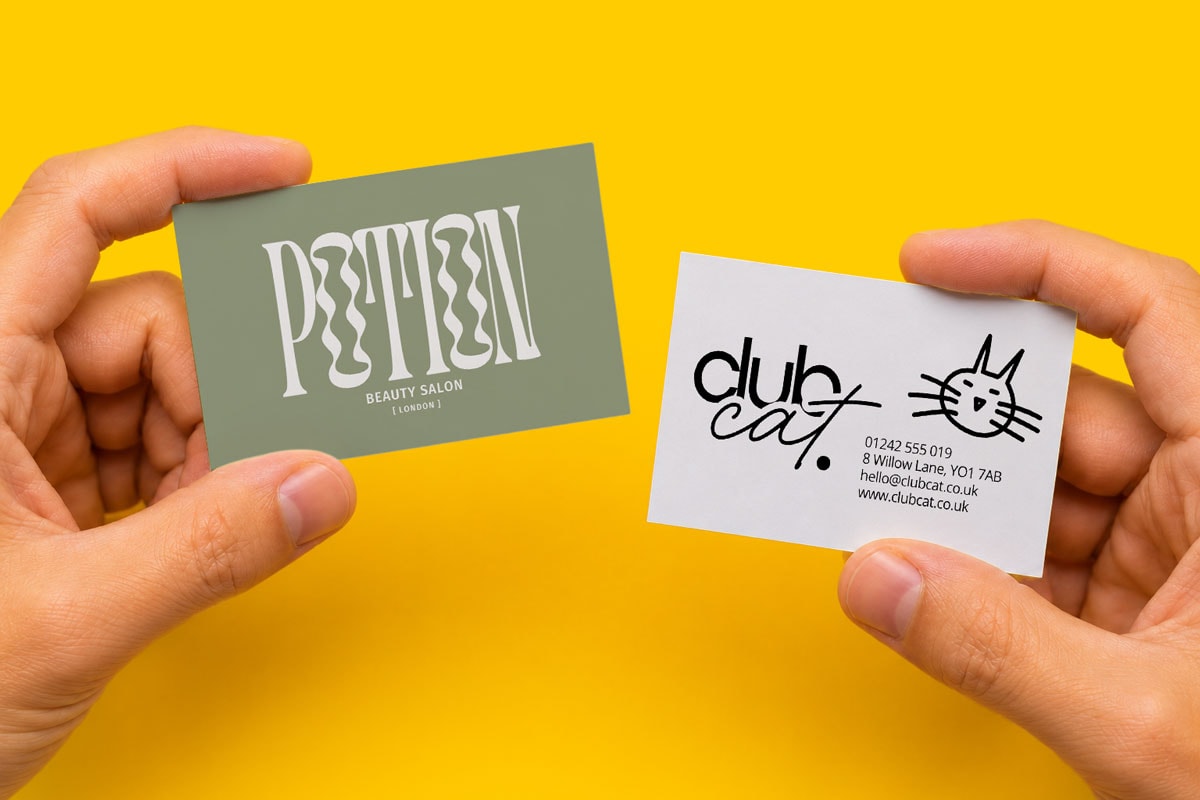 Two hands hold business cards for "Potion" and "Club Cat" against a yellow background.