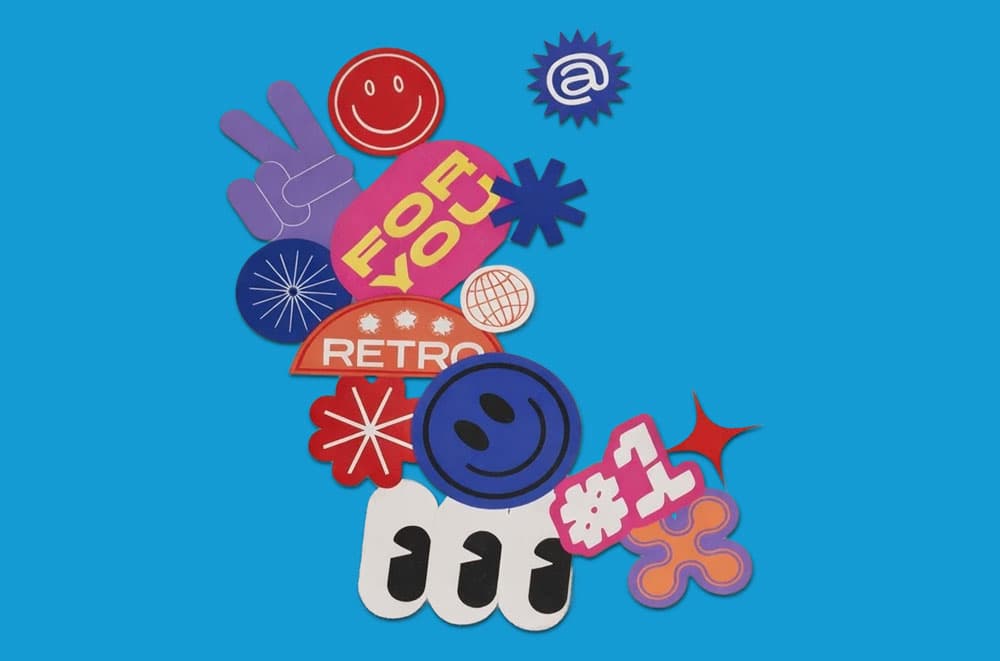 Colorful retro-style stickers with text and symbols on a bright blue background.