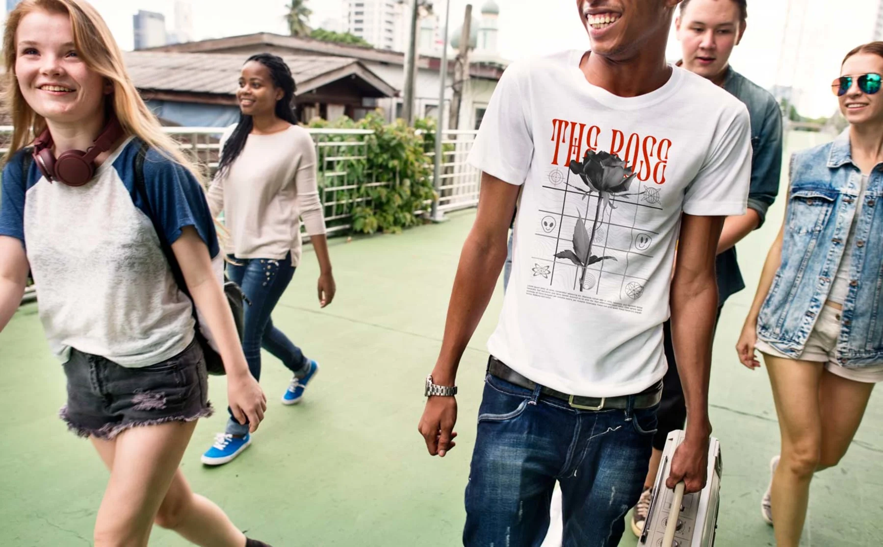 A group of young people walking together, featuring a man in a modern, sleek organic t-shirt