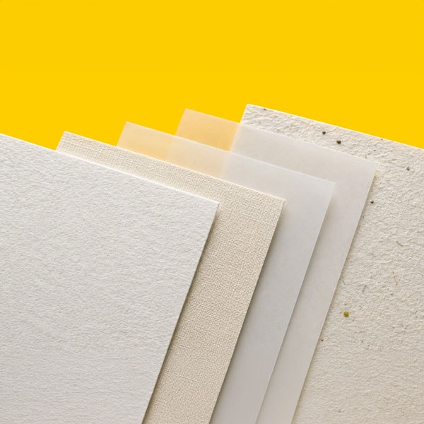 Five different textured and colored paper sheets are stacked against a bright yellow background.