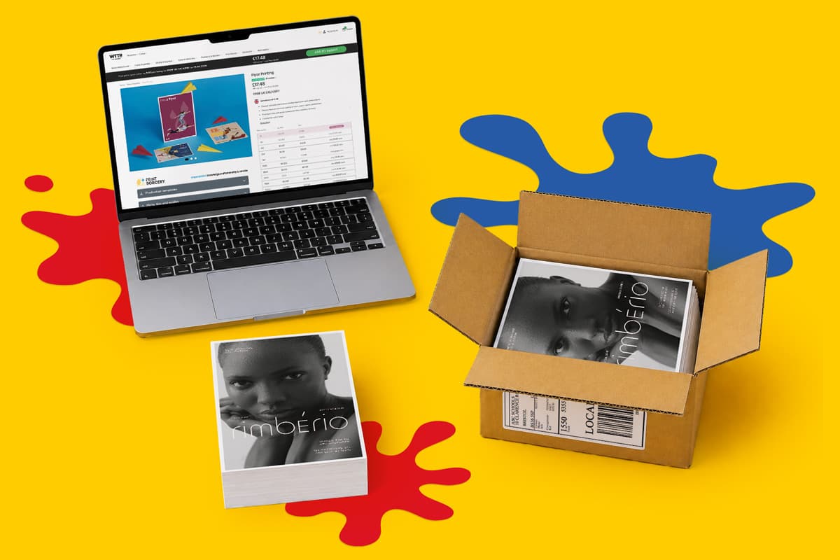 Open laptop, printed flyers, and a shipping box on a yellow background with paint splashes.