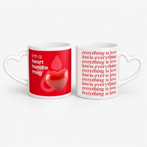 Two white mugs with heart-shaped handles, showing red heart graphics and text.