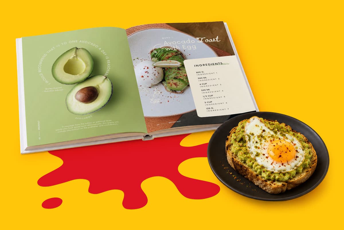 Open cookbook showing avocado toast recipe next to a plate with avocado toast and a fried egg.