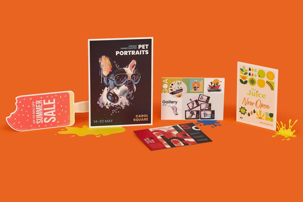 Assorted colourful promotional signage on an orange background.