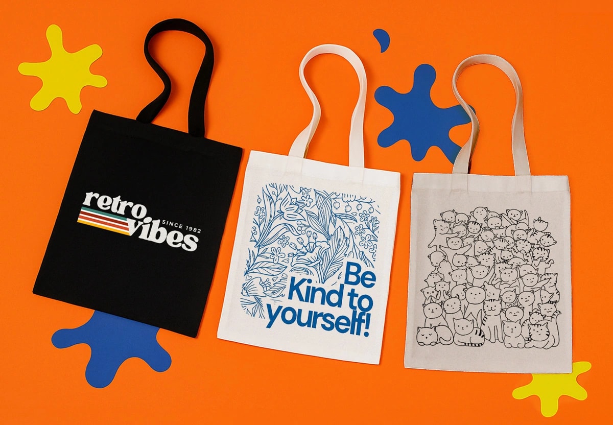 Three tote bags with different designs on an orange background with blue and yellow shapes.
