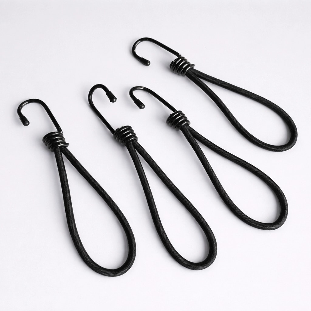 Four black bungee cords with hooks arranged on a white surface.