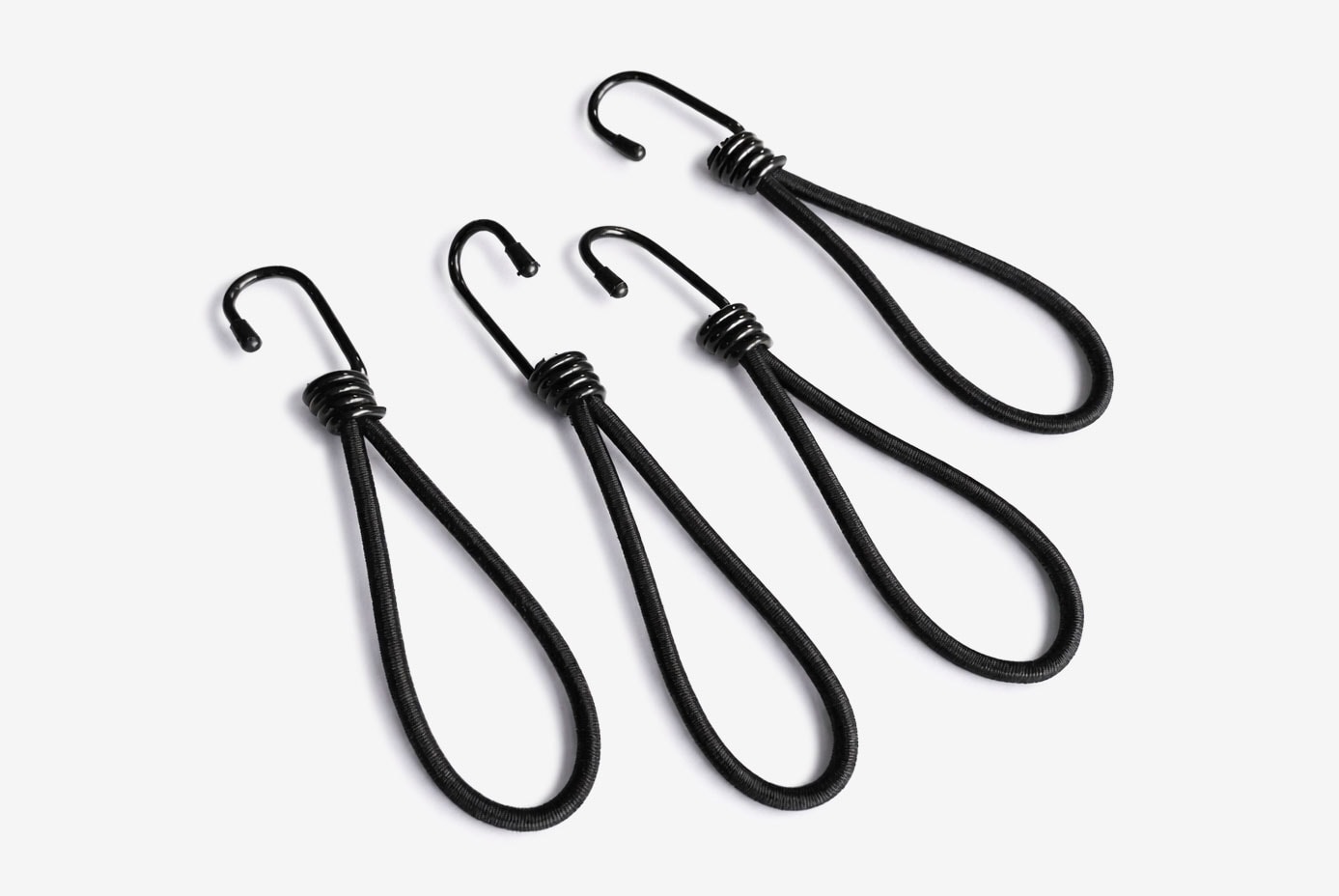 Four black bungee cords with hooks, arranged side by side on a white background.