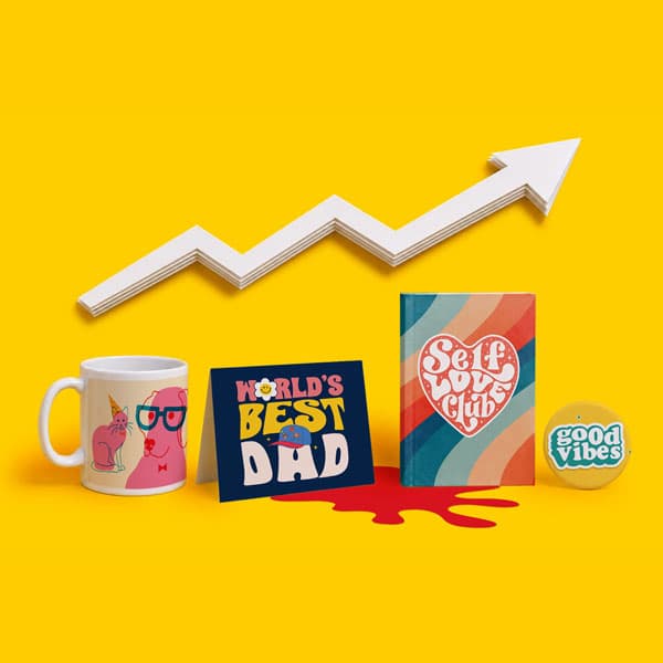 Mug, cards, notebook, and button on yellow background with white arrow pointing upward.