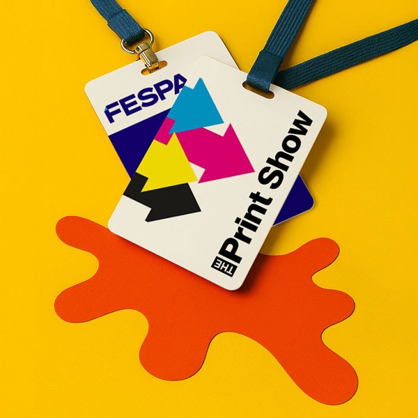 Two event badges on lanyards labeled “FESPA” and “The Print Show” on a yellow background.