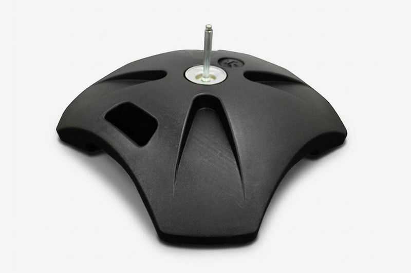 Black umbrella base with a central metal pole on a plain white background.