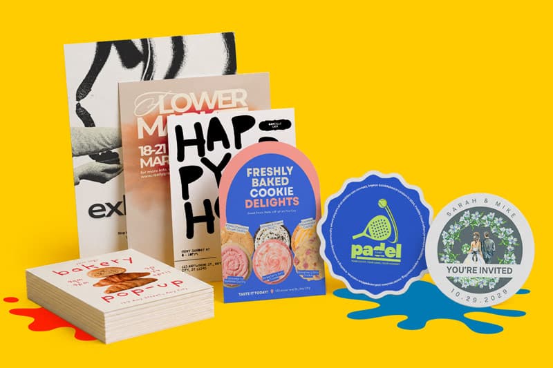 Assorted colorful event flyers, postcards, and stickers displayed on a yellow background.