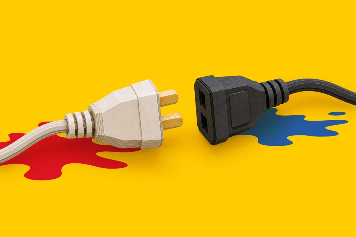 Two power plugs facing each other on a yellow background with red and blue paint splashes.