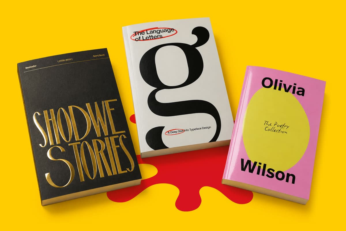 Three different books are displayed upright on a yellow surface with a red paint splash design.