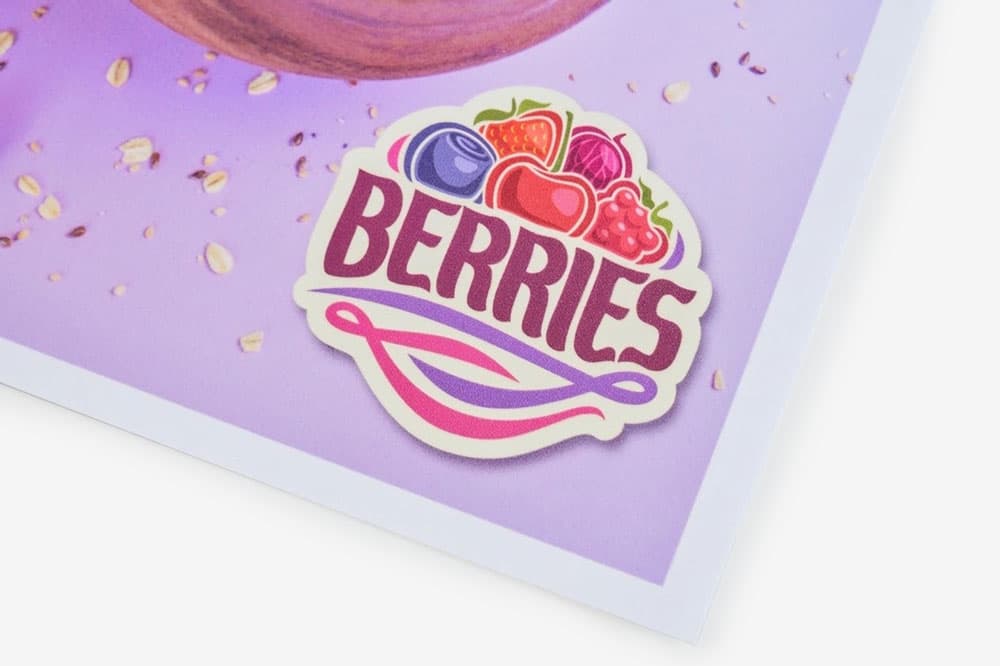 Sticker with the word "BERRIES" and illustrations of various berries on a purple background.