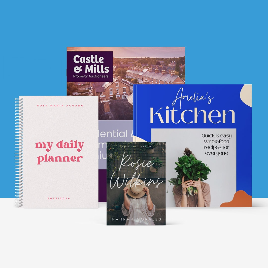 Displayed items include a book, a daily planner, and a cookbook, all positioned to highlight their unique designs.