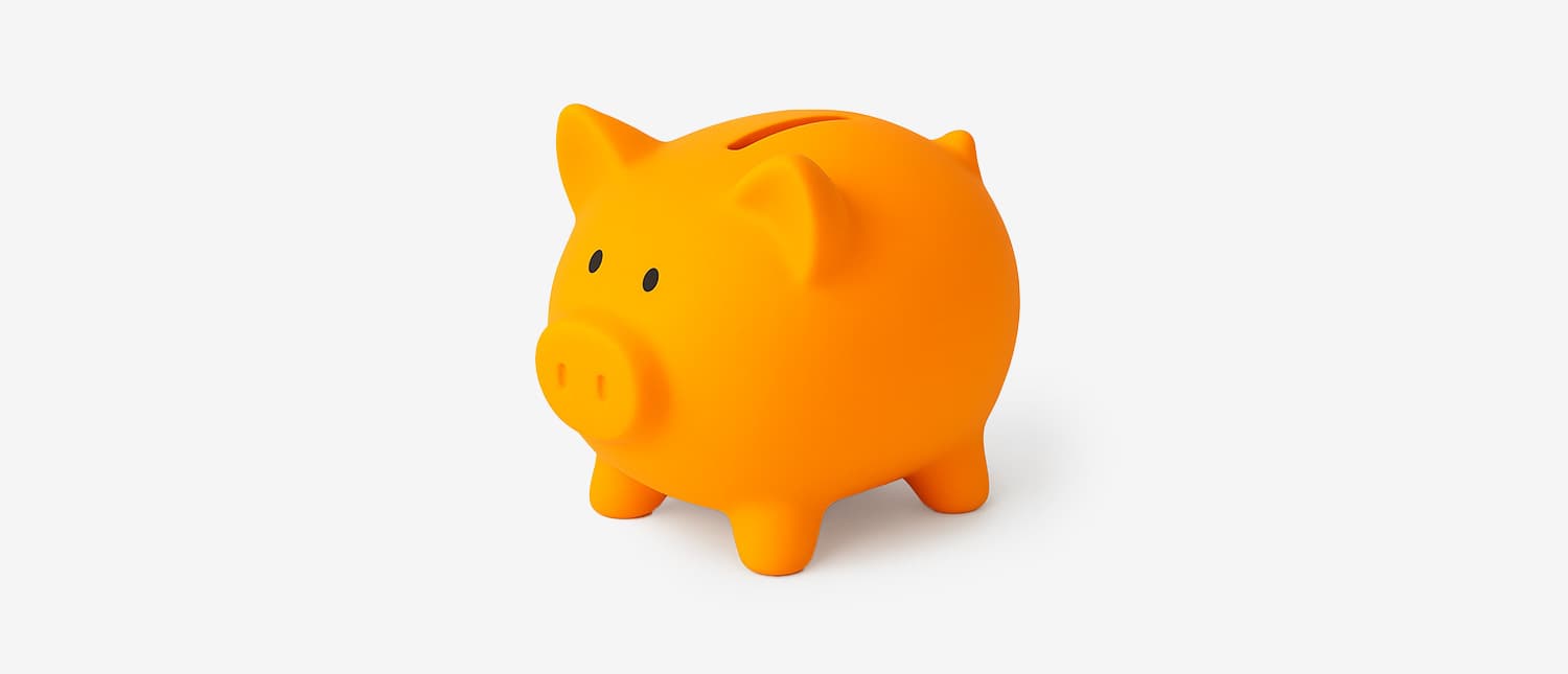 A vibrant orange piggy bank displayed against a white background, representing the concept of saving money.