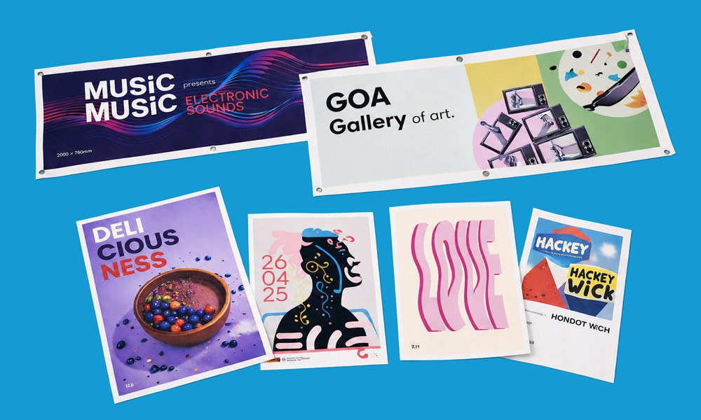 Six colourful, modern event and art posters displayed on a wide, blue surface.