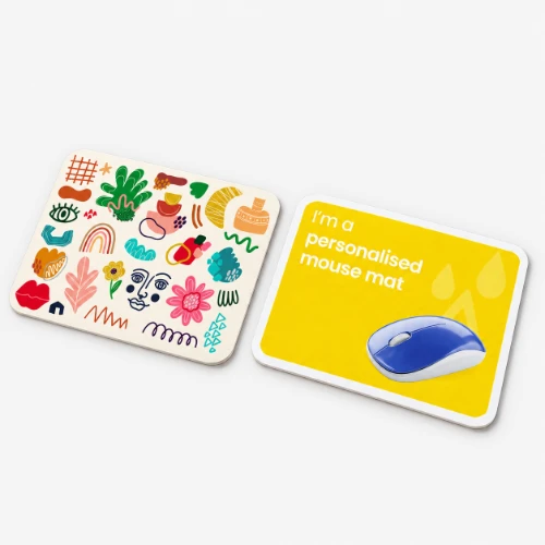 Two mouse pads, one with abstract colorful patterns and one yellow with text and a mouse graphic.