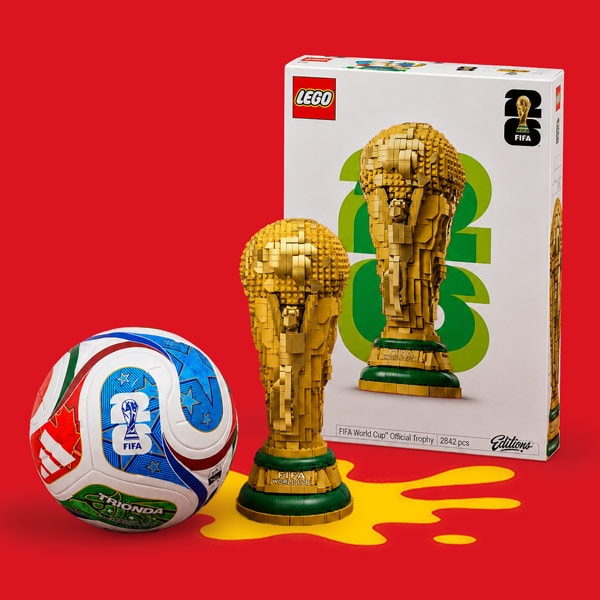LEGO FIFA World Cup trophy set with a soccer ball and packaging on a red background.