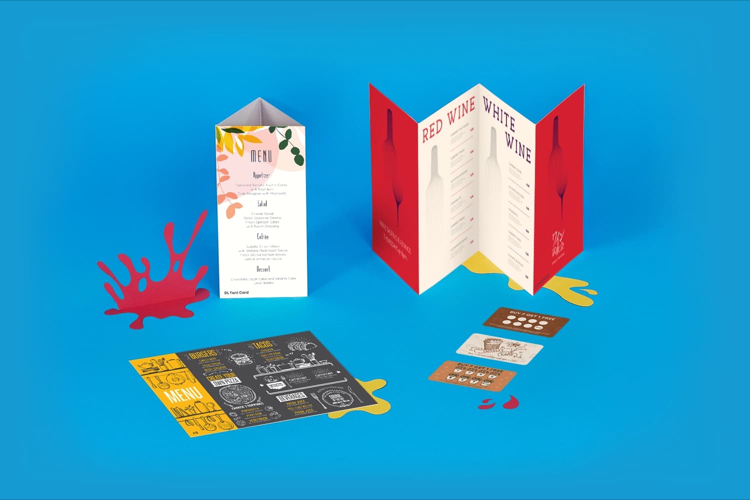 Various folded menus and cards displayed on a blue background.