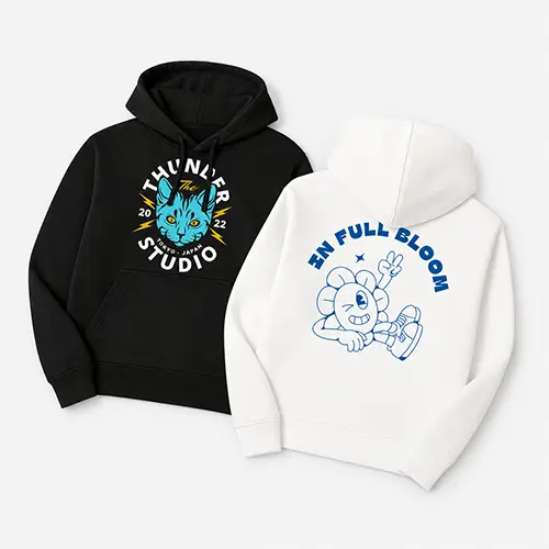 Black hoodie with a cat graphic and a white hoodie with a flower character.