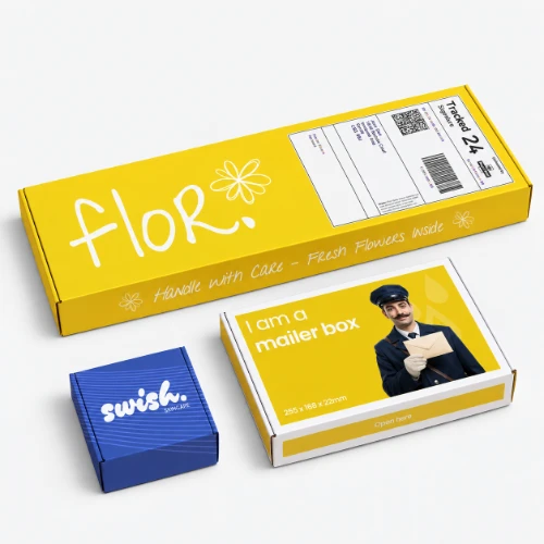 Three branded shipping boxes of varying sizes on a white background.