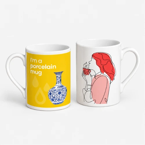 Two white ceramic mugs, one with a yellow design of a vase and text, one with a line-art woman.