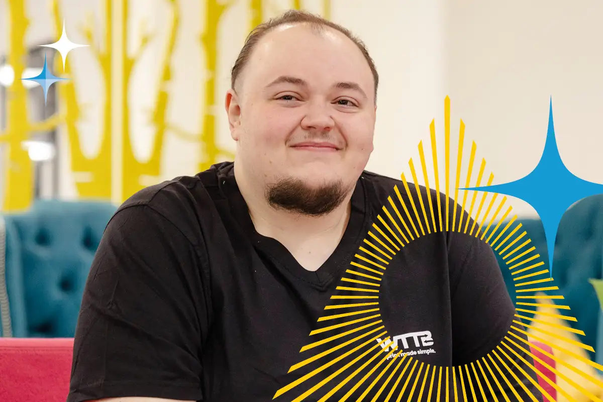 Person with short hair and goatee sits indoors, smiling, with abstract graphics over the image.