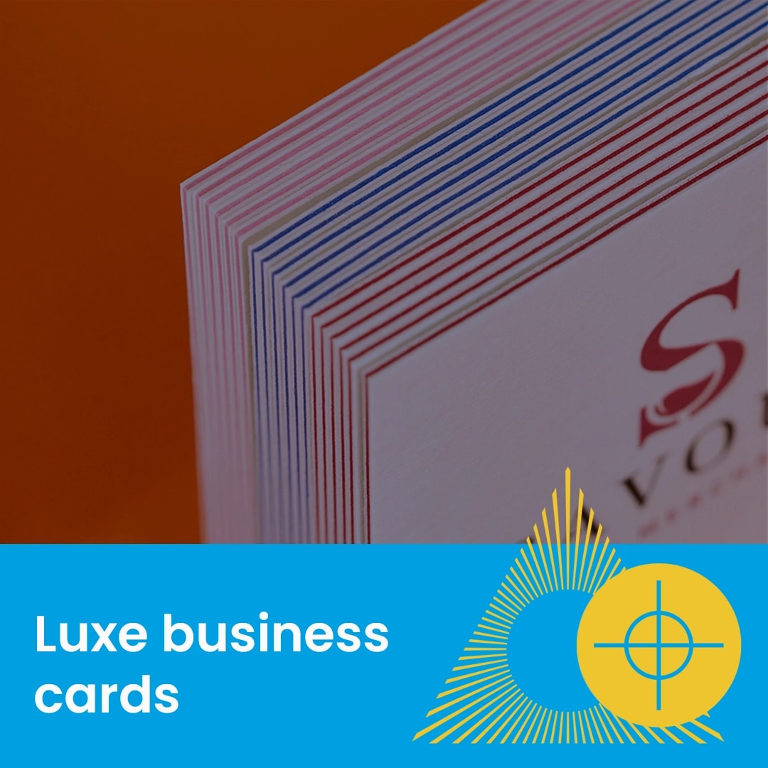 Stack of thick, multicolored edge business cards with "Support Guide" text overlay.