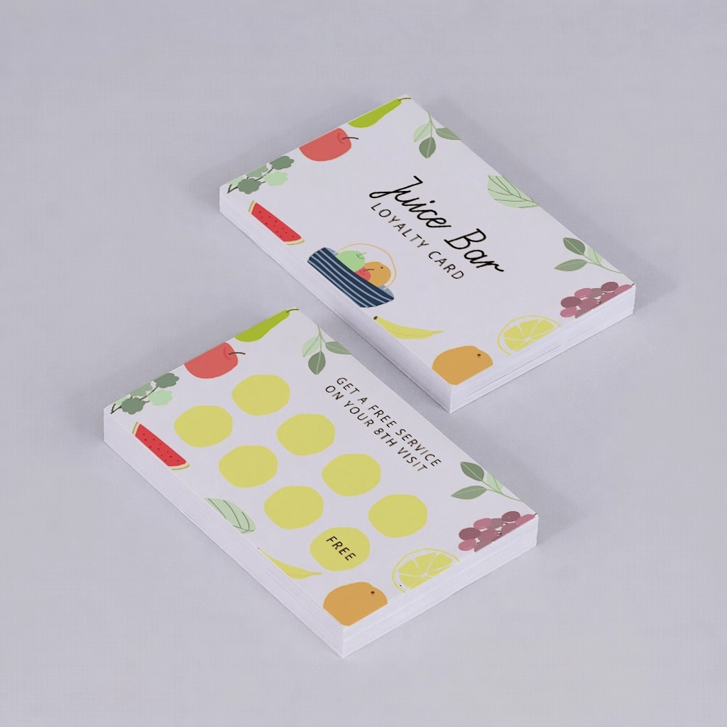 Two stacks of Juice Bar loyalty cards with colorful fruit illustrations on a light background.