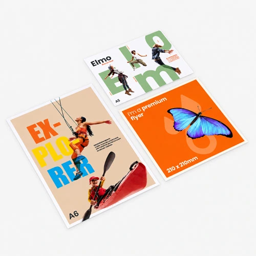 Three colourful A6 flyers on a gray surface, featuring bold text and graphic images.