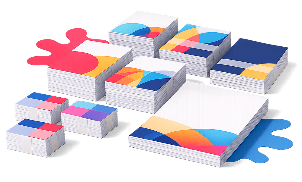 Stacks of colorful, abstract-patterned rectangular and square paper on a white background.