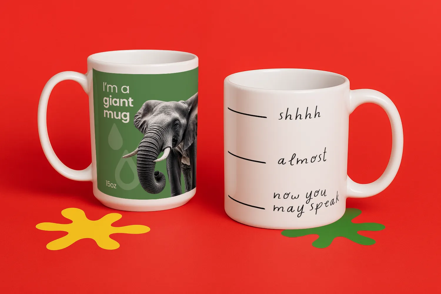 Two ceramic mugs on a red surface, one with an elephant design, one with humorous text.