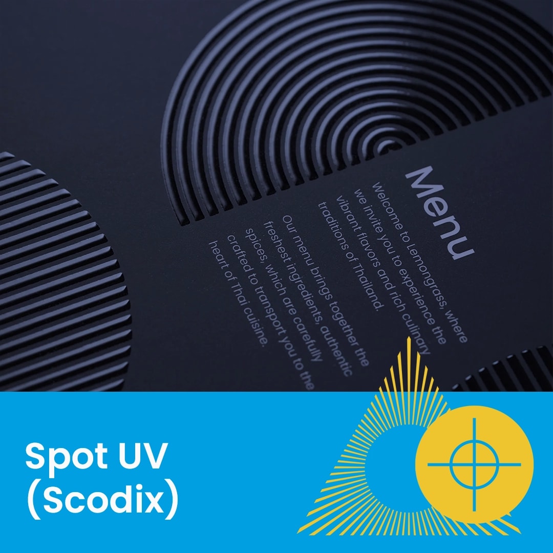 Black menu cover with raised circular spot uv patterns, labeled "Spot UV (Scodix)" at the bottom.
