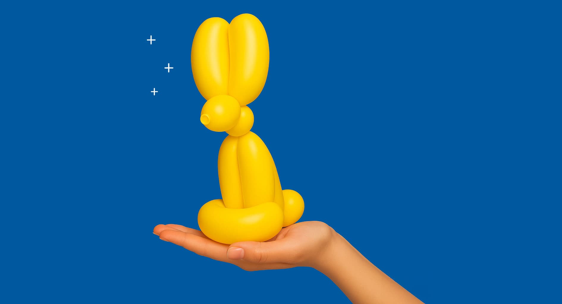 A hand holds a yellow balloon animal shaped like a rabbit against a blue background.
