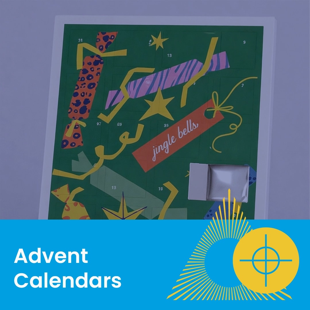 A green advent calendar with numbered doors and festive patterns, one door is open.