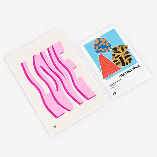 Two art prints: one with "LOVE" in pink wavy letters, one with abstract shapes labeled "HACKNEY WICK.