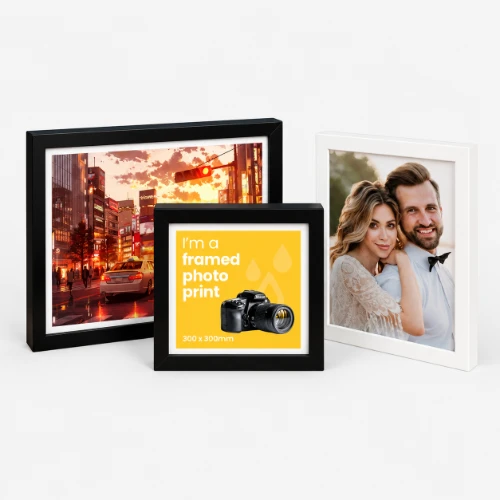 Three framed photo prints displayed together.