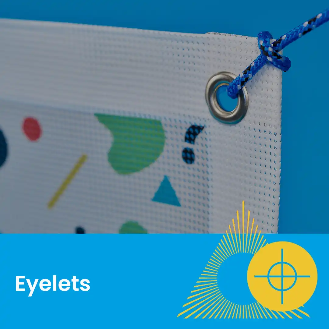 Close-up of a banner corner with a metal eyelet and rope, labeled “Eyelets” at the bottom.