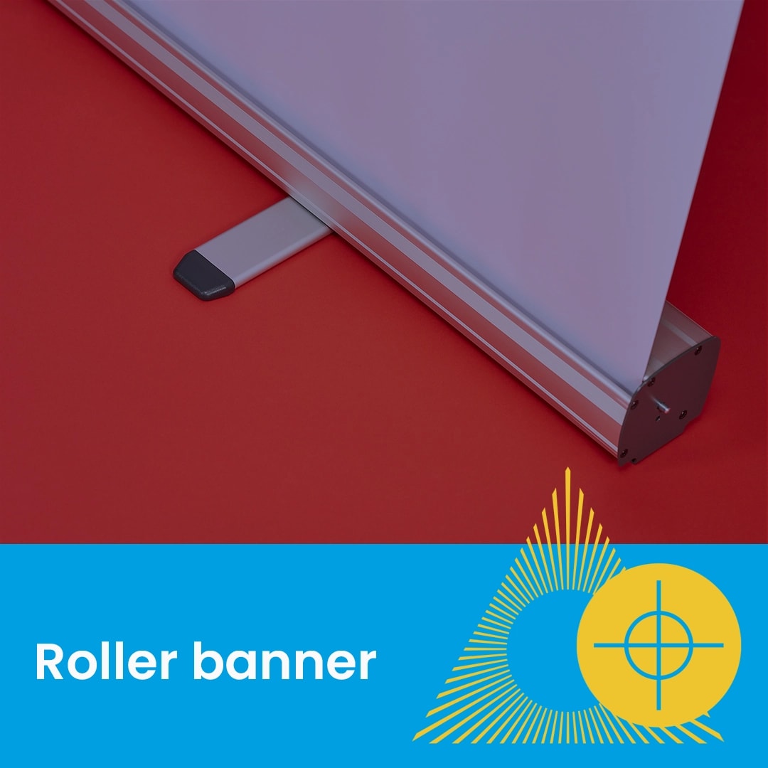 Close-up of a roller banner stand on a red surface with text "Roller banner" below.