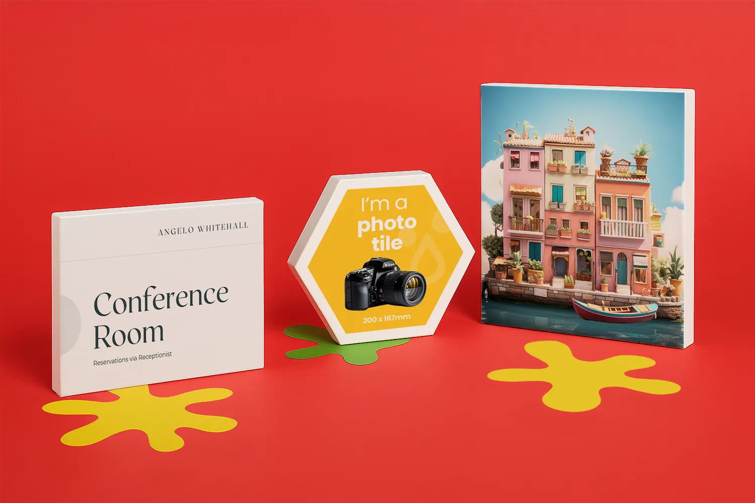 Three photo tiles stand upright on a red surface with yellow decorative shapes.