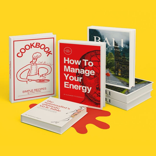 Five books stacked and standing upright on a yellow surface with a red splash underneath.